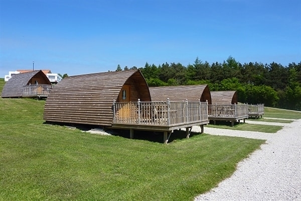 Relax in our heated wooden Wigwam® Cabins